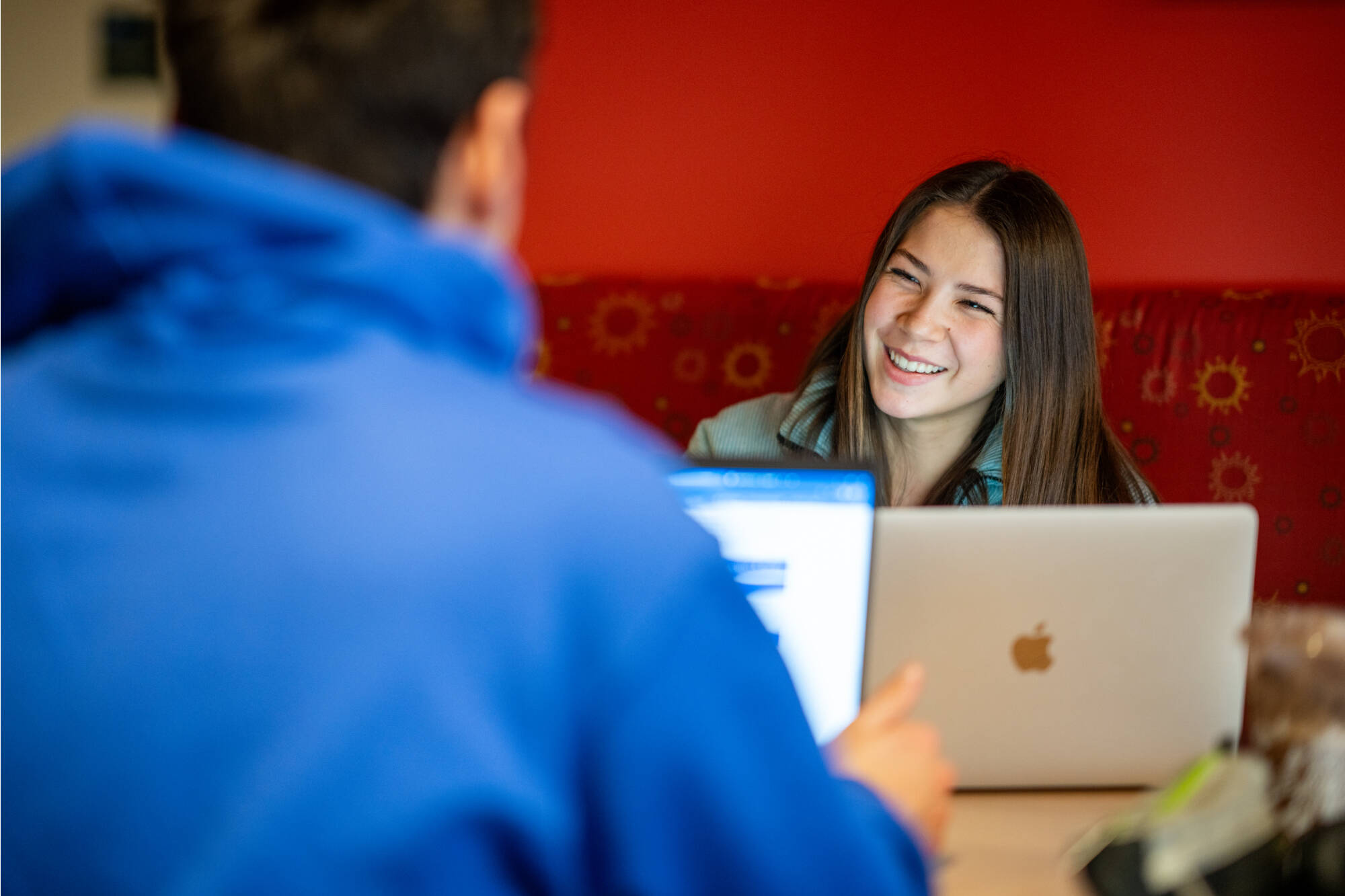 First-year nursing student Emma Flanders talks with a friend while studying in the Mary Idema Pew Library January 25, 2024. (Photo by Amanda Pitts)